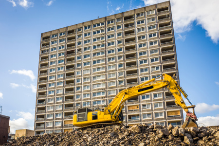 Digger infront of building site