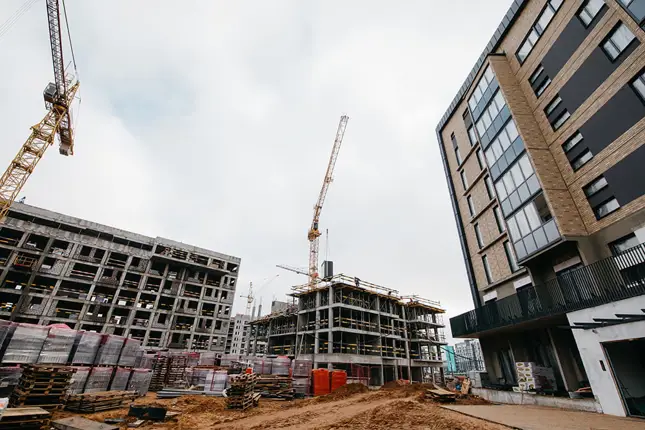 a construction site with cranes a construction site with cranes